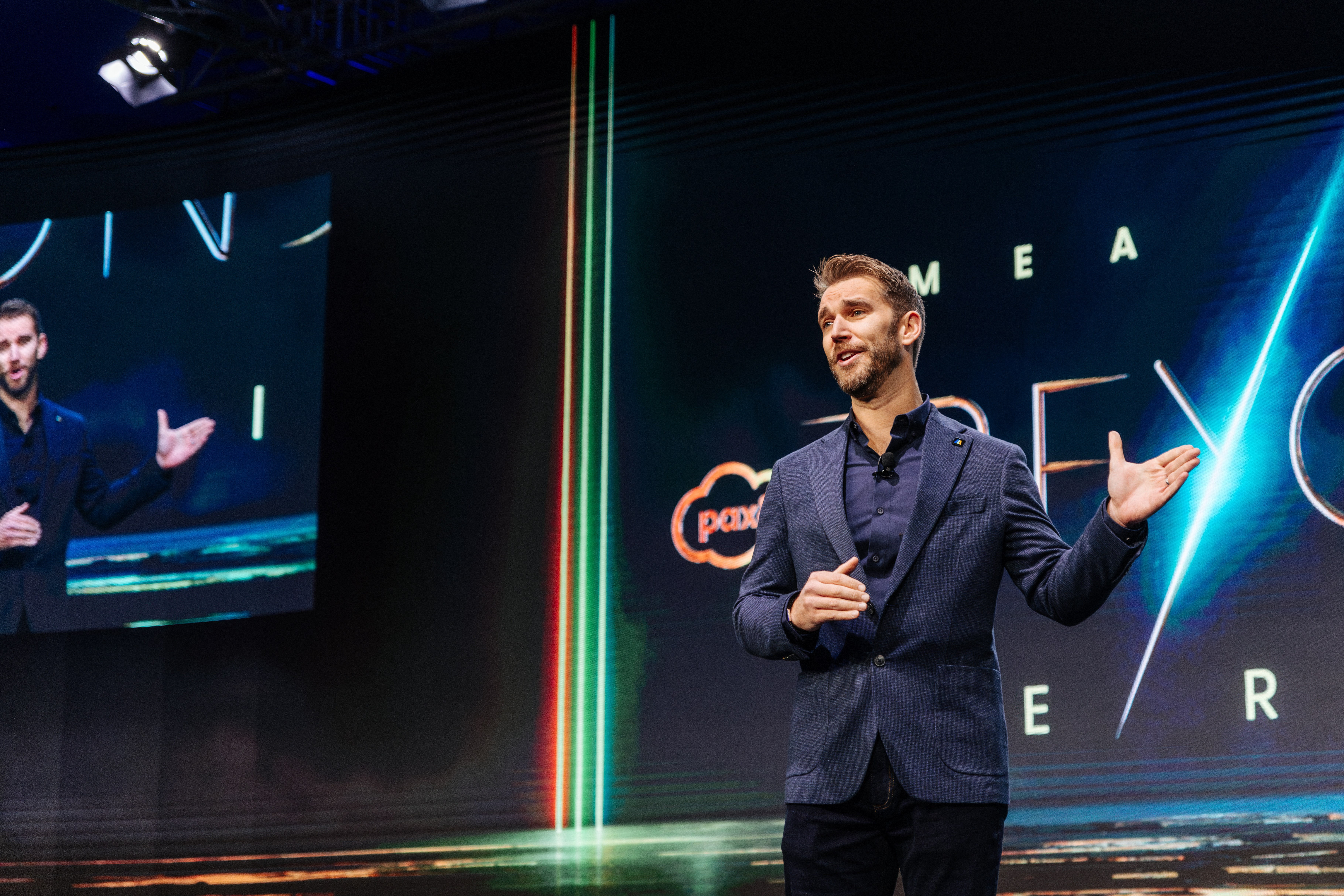 Jonathan Griffiths on stage at a major speaking engagement