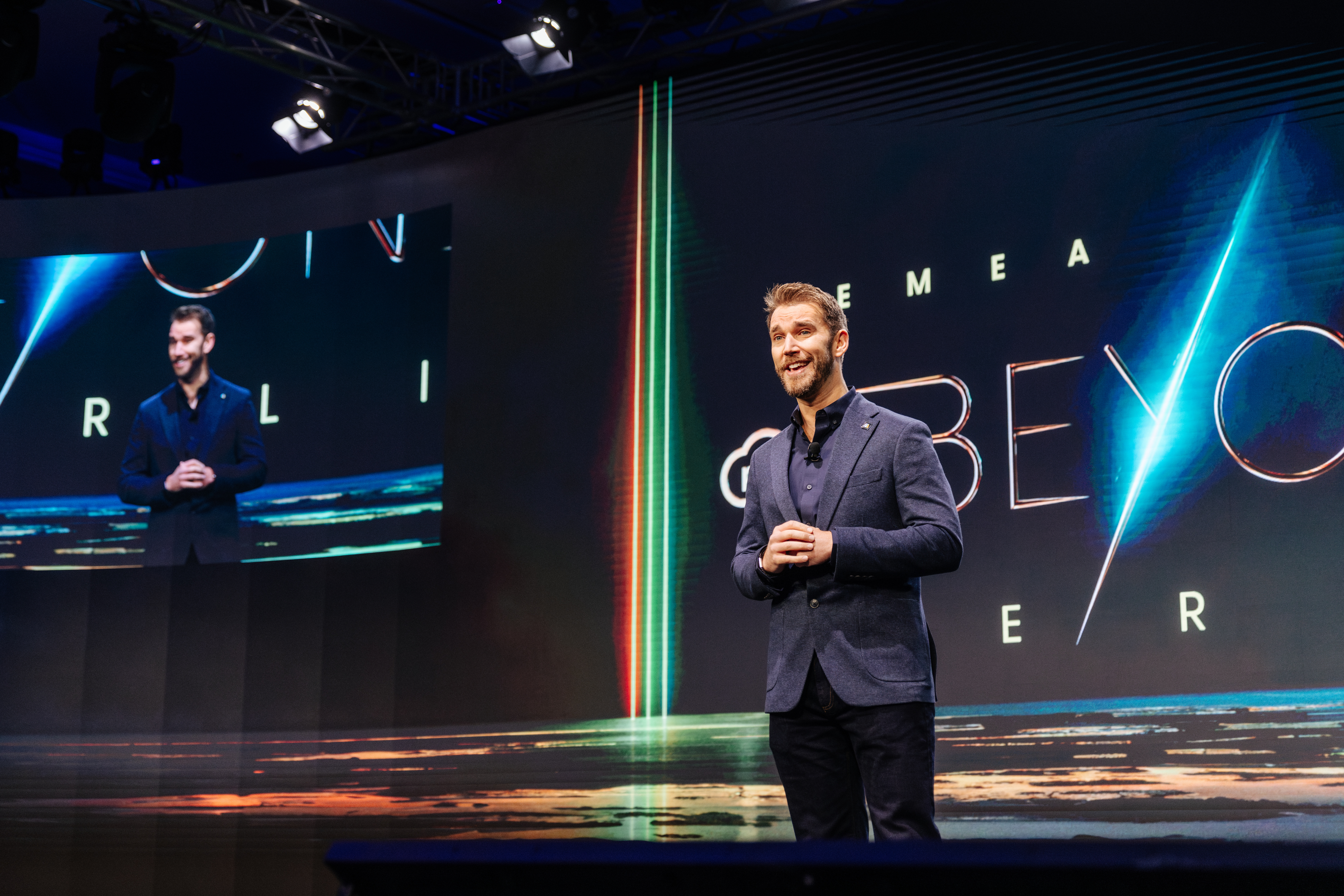 Jonathan Griffiths speaking at Rugby World Cup 2019, audience and Webb Ellis Trophy in frame