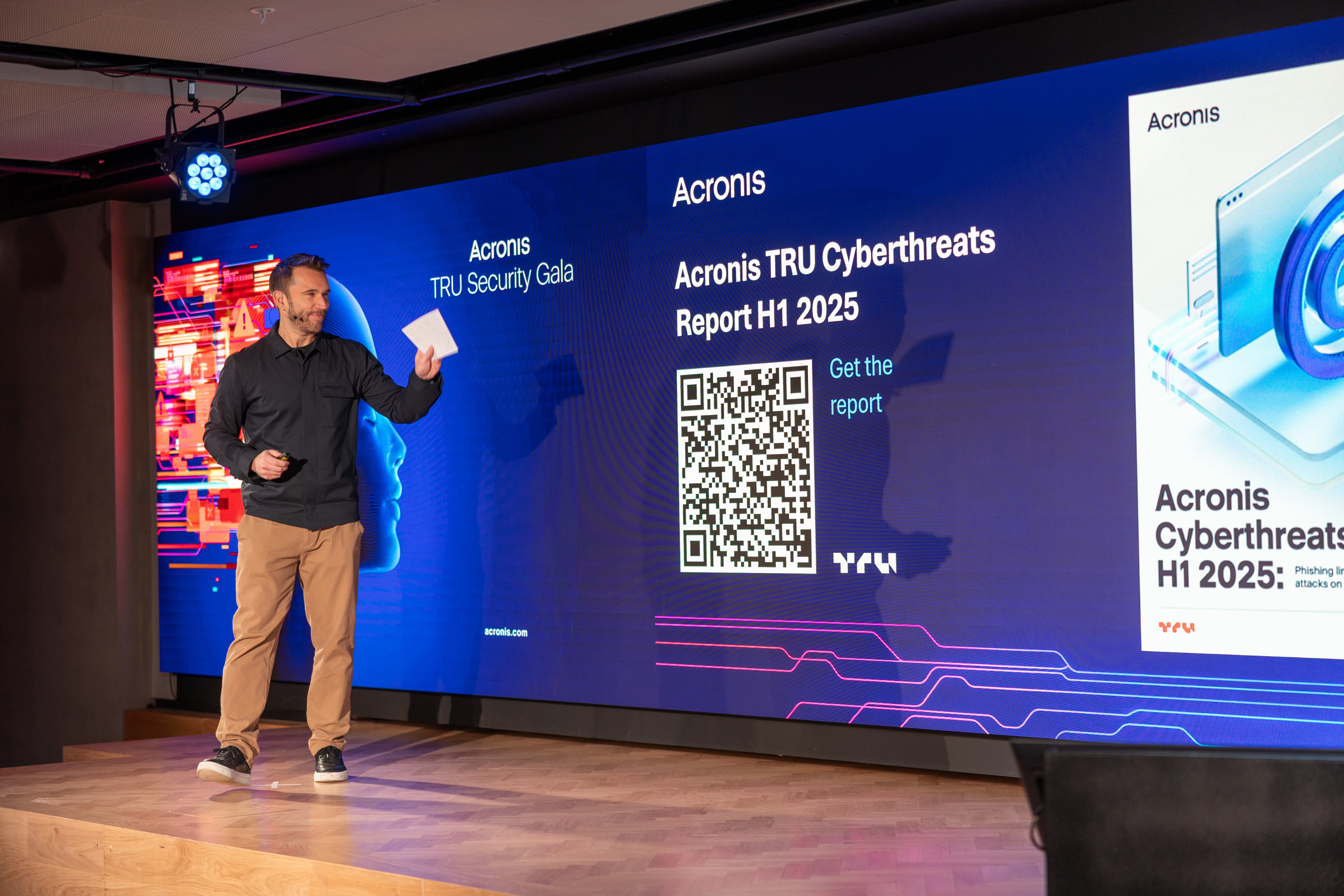 Jonathan Griffiths hosting on stage at Acronis